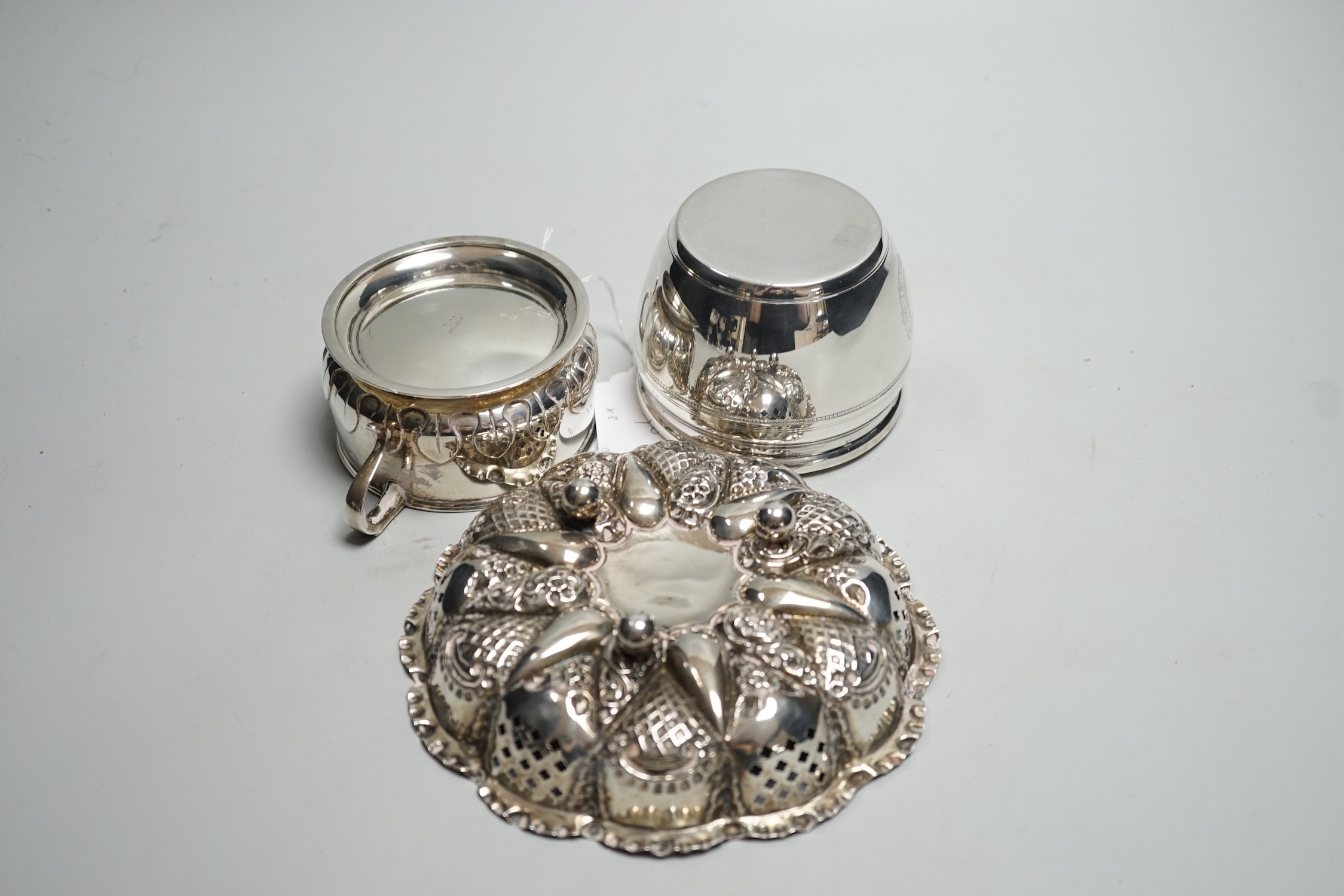 An Edwardian repousse silver shallow bowl, Birmingham, 1901, 16.1cm, together with a modern silver toilet jar and a 1920's silver two handled small bowl, 14.9oz.